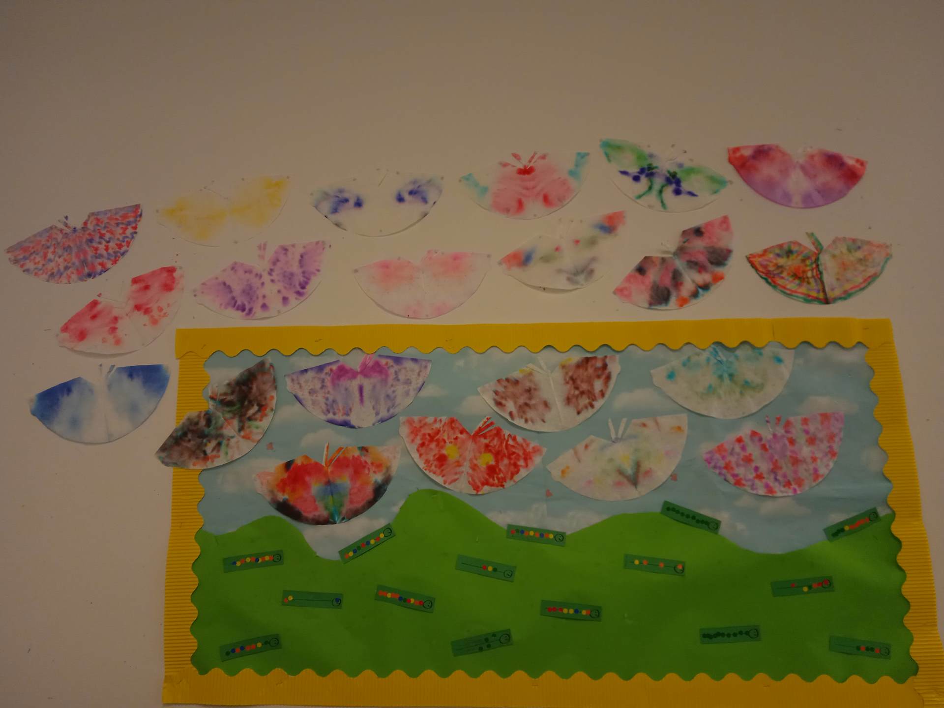 Display with sticker caterpillars and butterflies